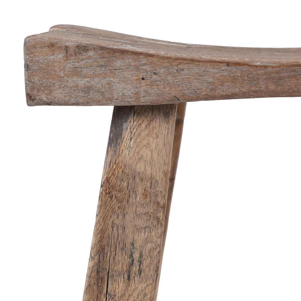 Corner Detail From Rustic 19th Century Elm Saddle Stool With Hand Shaped Seat And Stretcher Supports Showing Natural Patina And Age Wear | Indigo Antiques