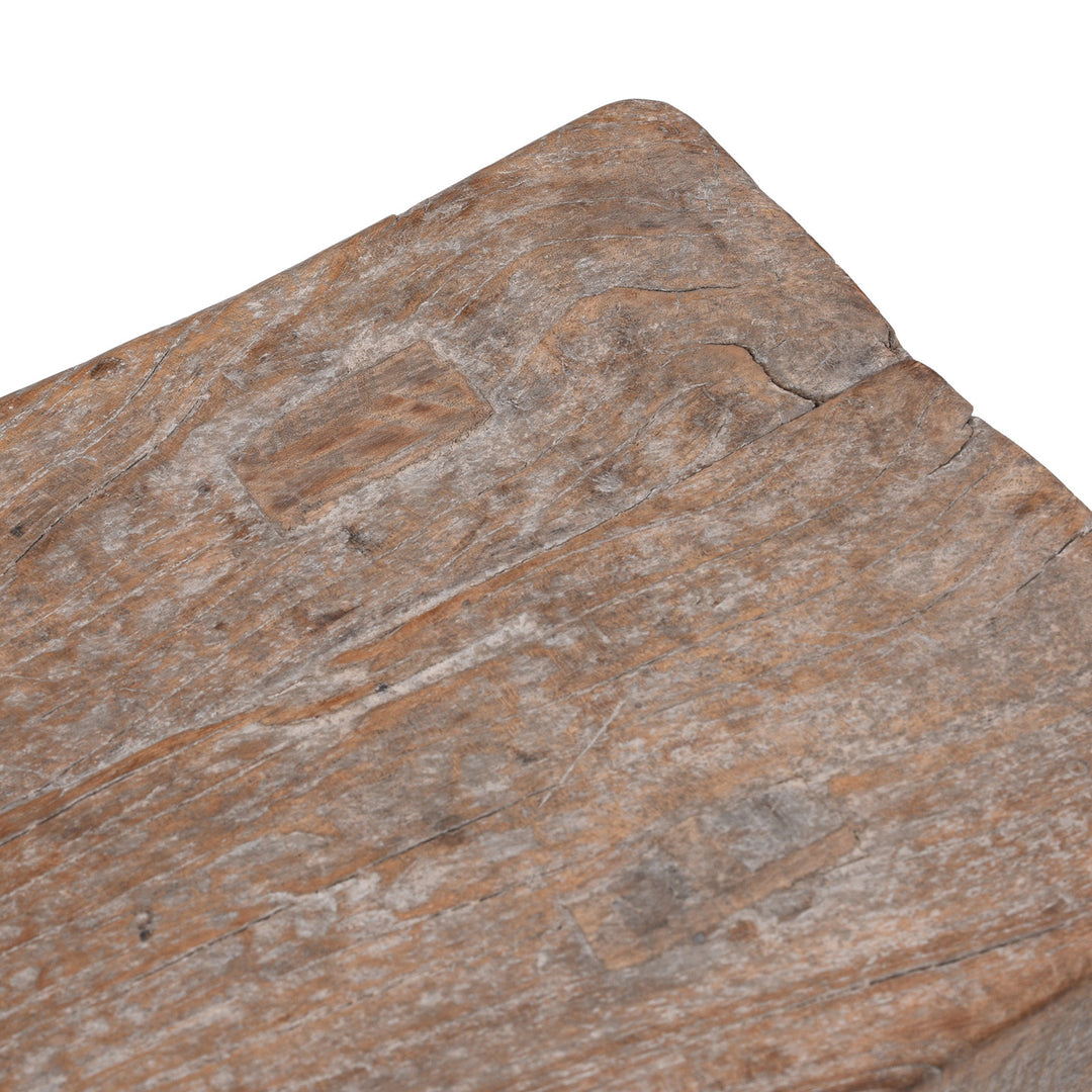 Top Corner Detail From Rustic 19th Century Elm Saddle Stool With Hand Shaped Seat And Stretcher Supports Showing Natural Patina And Age Wear | Indigo Antiques