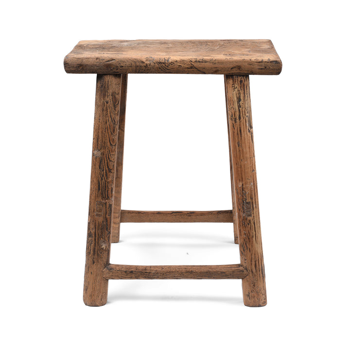 Side On View Of Antique Chinese Elm Farmers Milking Stool With Rustic Handcrafted Rectangular Seat And Splayed Legs