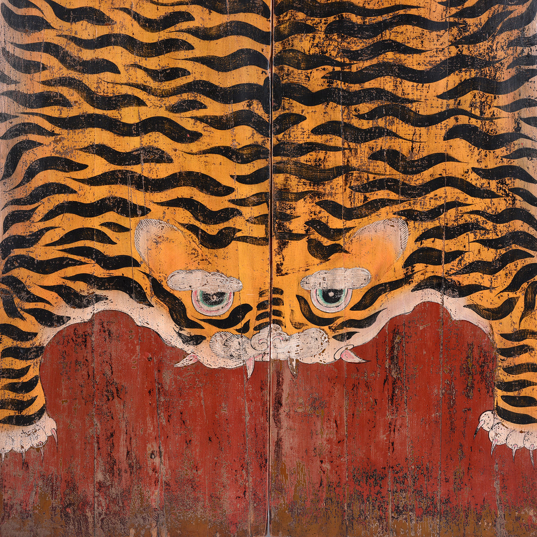 Tiger Face Detail From Hand Painted Reproduction Qinghai Tiger Doors With Stylised Striped Motif On Distressed Red Background