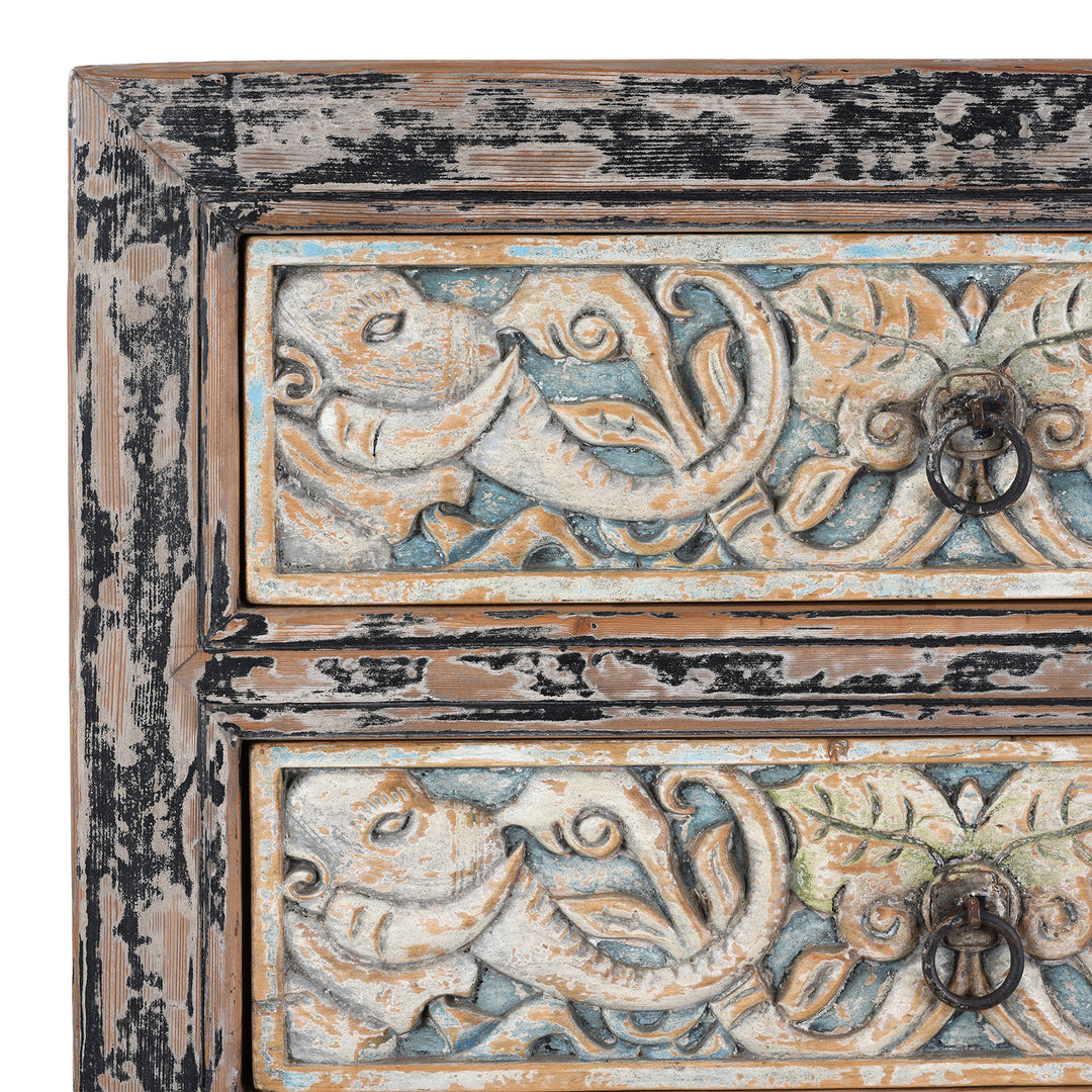 Detail Of Paintwork From Hand-Carved Indian Chest Of Drawers With Floral Motifs And Distressed Painted Finish
