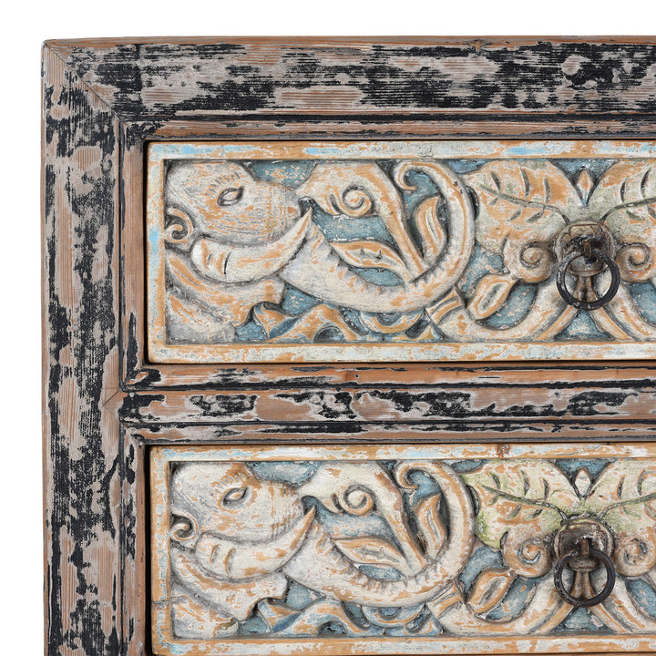 Detail Of Paintwork From Hand-Carved Indian Chest Of Drawers With Floral Motifs And Distressed Painted Finish