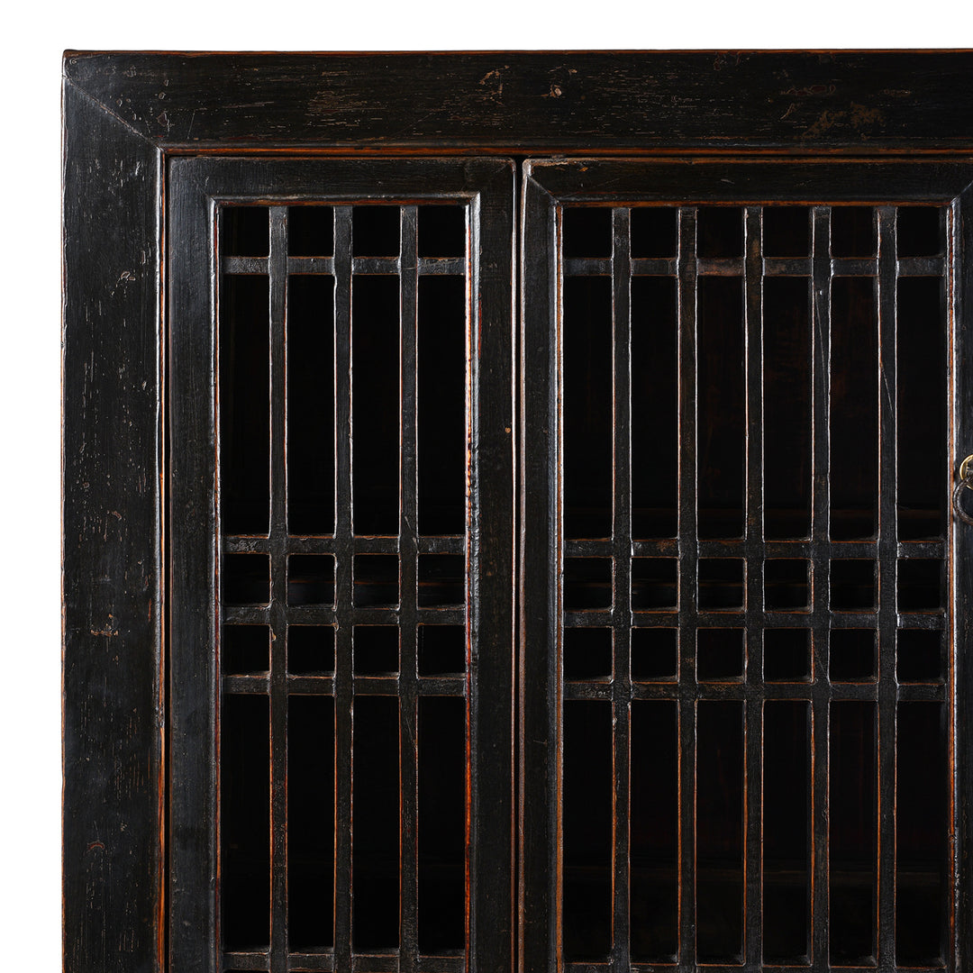 Corner Detail From Antique Chinese Black Lacquered Cabinet With Upper Lattice Doors And Lower Panelled Cupboard And Drawer Section
