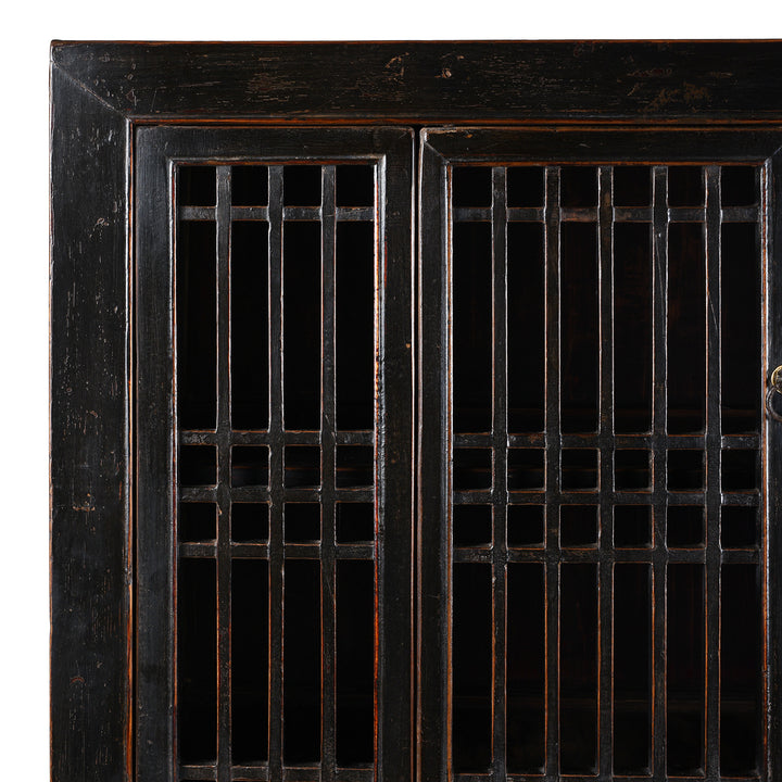 Corner Detail From Antique Chinese Black Lacquered Cabinet With Upper Lattice Doors And Lower Panelled Cupboard And Drawer Section