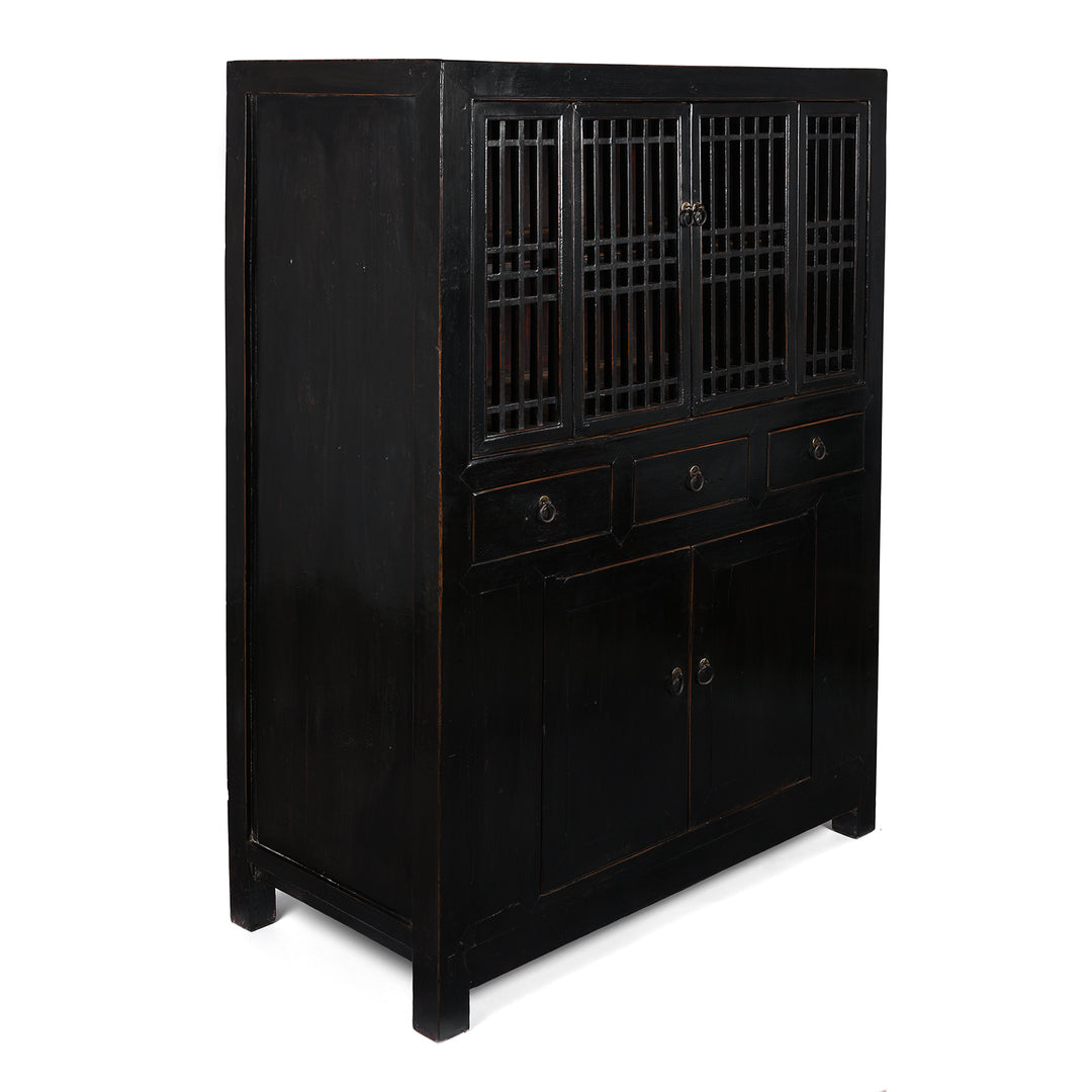 Angled VIew Of Antique Chinese Black Lacquered Cabinet With Upper Lattice Doors And Lower Panelled Cupboard And Drawer Section   