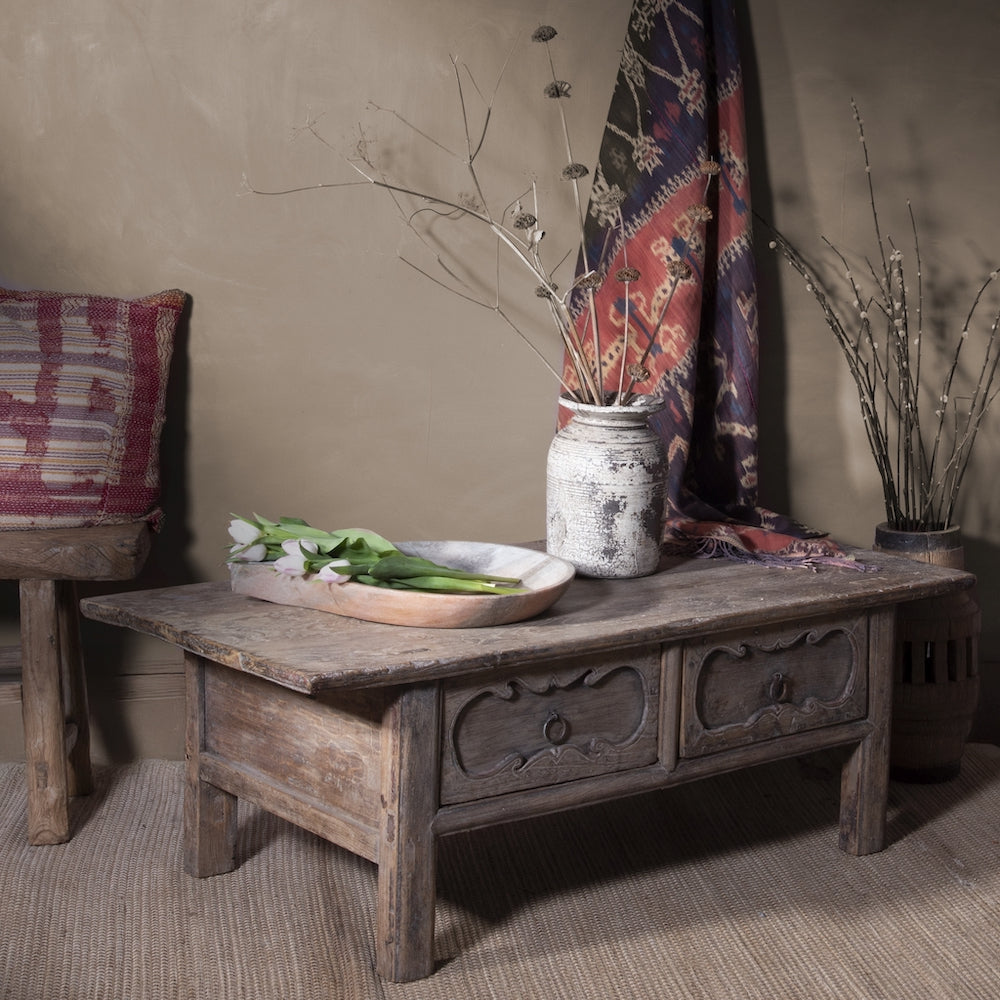 Reclaimed wood coffee table with a pot and bowl