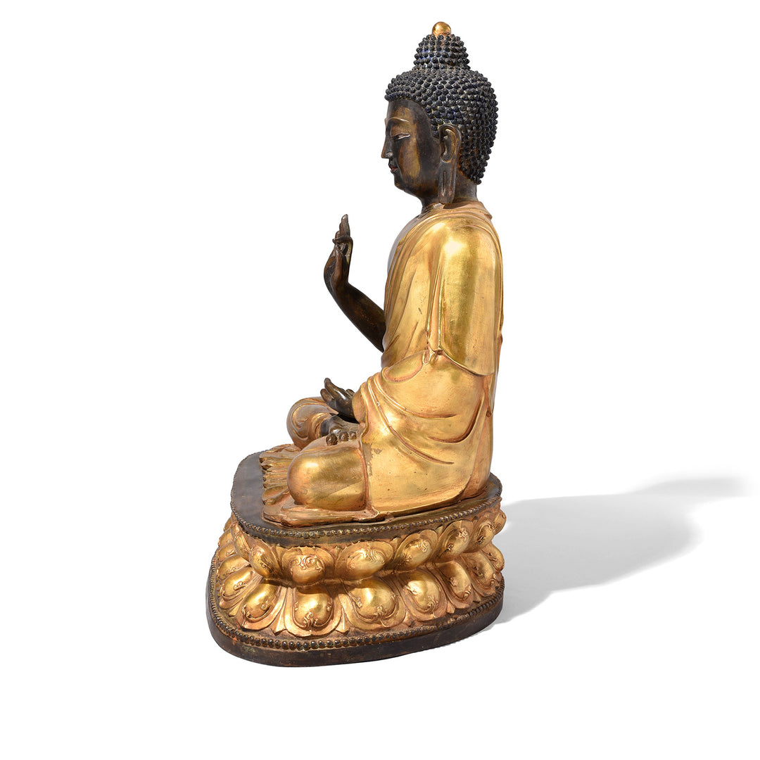 Side view Of Gilt Brass Sitting Buddha - Vitarka Mudra | Indigo Antiques