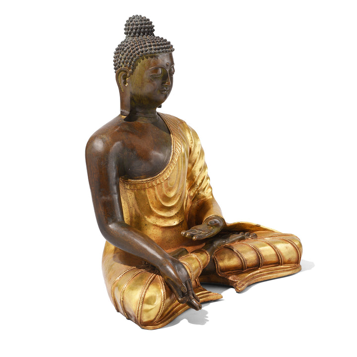 Angled View Of Gilt Bronze Sitting Buddha Statue - Varada Mudra | Indigo Antiques