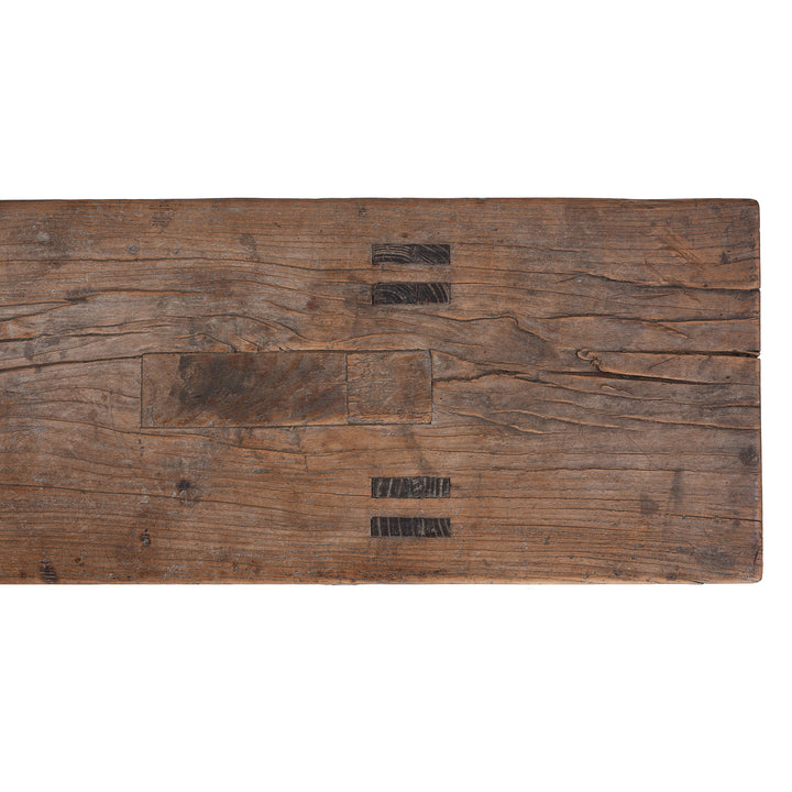 Detail From Top Of 19th century Chinese rustic solid walnut farm bench with thick plank top, trestle legs, original patina and traces of historic dark lacquer | Indigo Antiques
