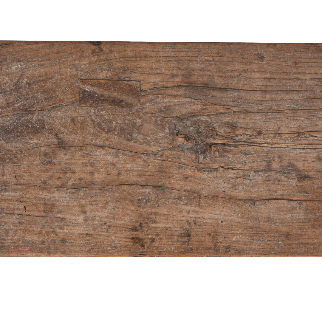Detail From 19th century Chinese rustic solid walnut farm bench with thick plank top, trestle legs, original patina and traces of historic dark lacquer | Indigo Antiques