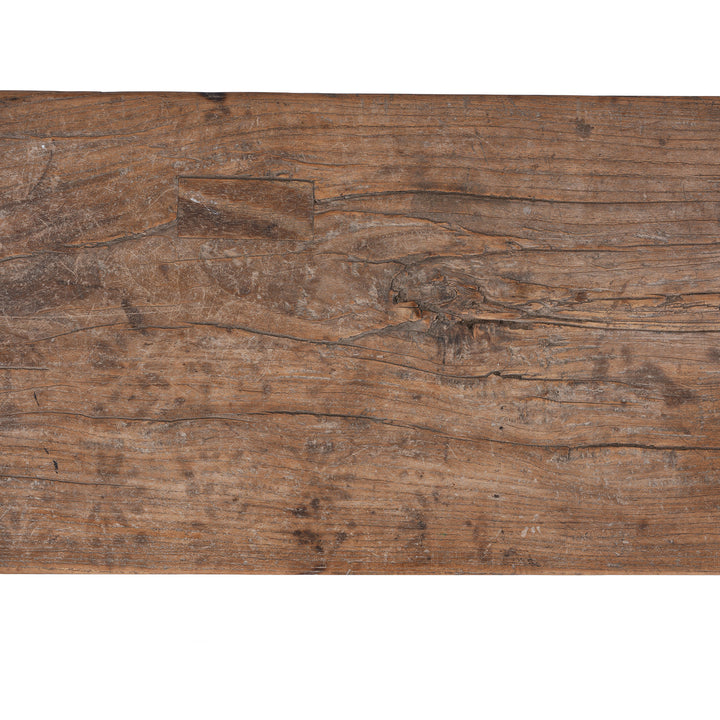 Detail From 19th century Chinese rustic solid walnut farm bench with thick plank top, trestle legs, original patina and traces of historic dark lacquer | Indigo Antiques