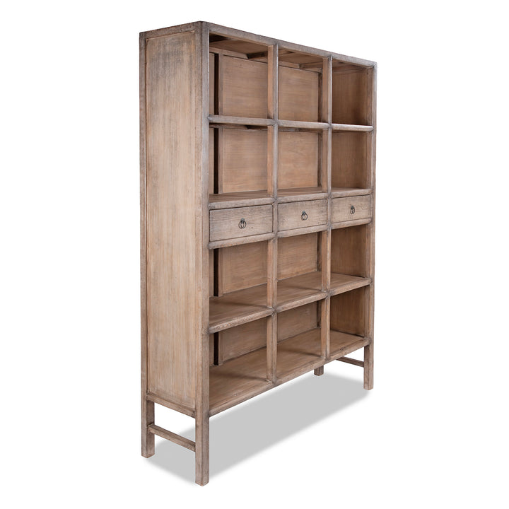 Angled View Of Chinese Bleached Pine Shelving Unit With Four Shelves And Three Drawers