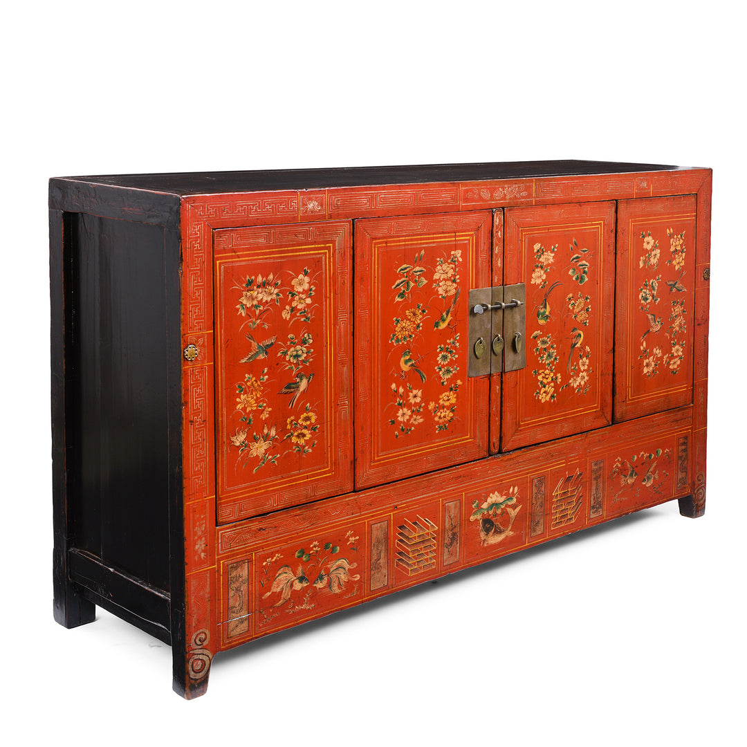 Angled VIew Of Original Lacquered Chinese Sideboard From Dongbei Manchuria With Handpainted Floral And Bird Motifs In Bright Red Finish Circa 1920s