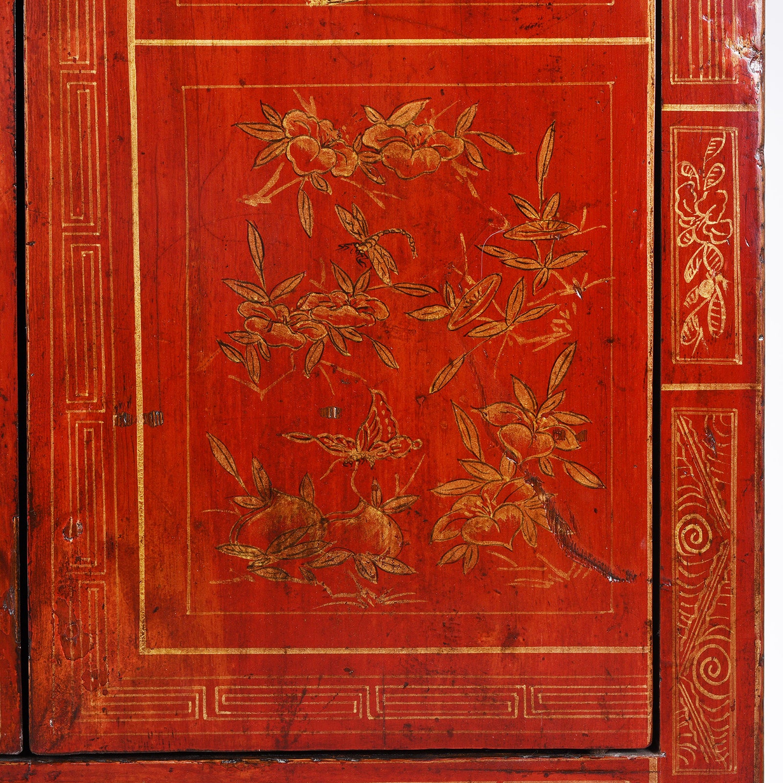 Door Detail From Antique Chinese Dongbei Sideboard With Red Lacquer Finish And Hand-Painted Gilded Landscape Motifs