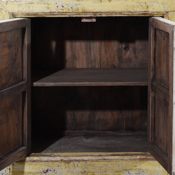 Interior View Of Antique Six Door Mongolian Painted Sideboard Made From Old Wood With Scalloped Yellow And White Decoration And Shelved Interior
