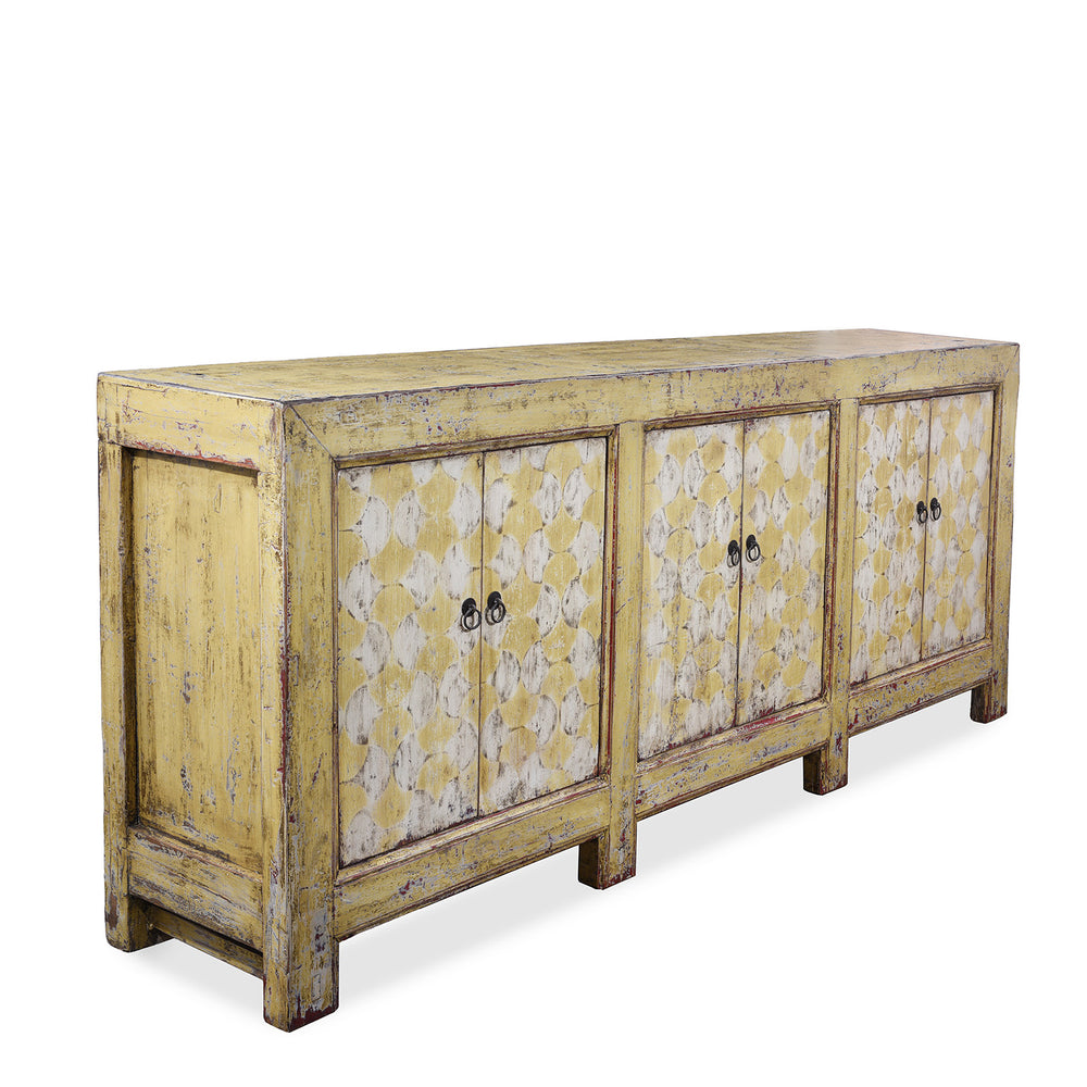 Angled View Of Antique Six Door Mongolian Painted Sideboard Made From Old Wood With Scalloped Yellow And White Decoration And Shelved Interior