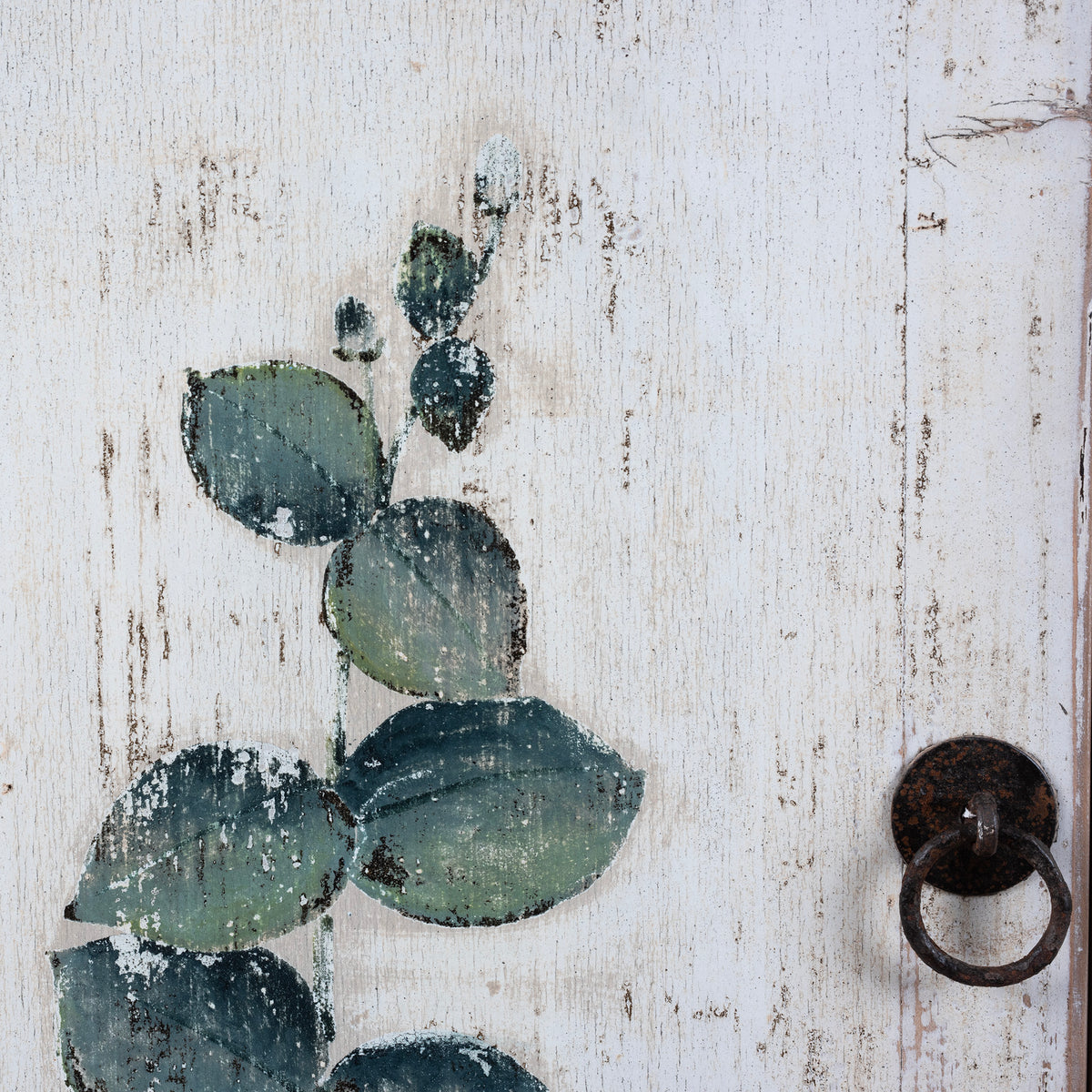 Detailed View Of Iron Handles From Distressed White Chinese Side Cabinet With Hand Painted Botanical Motifs On Double Doors