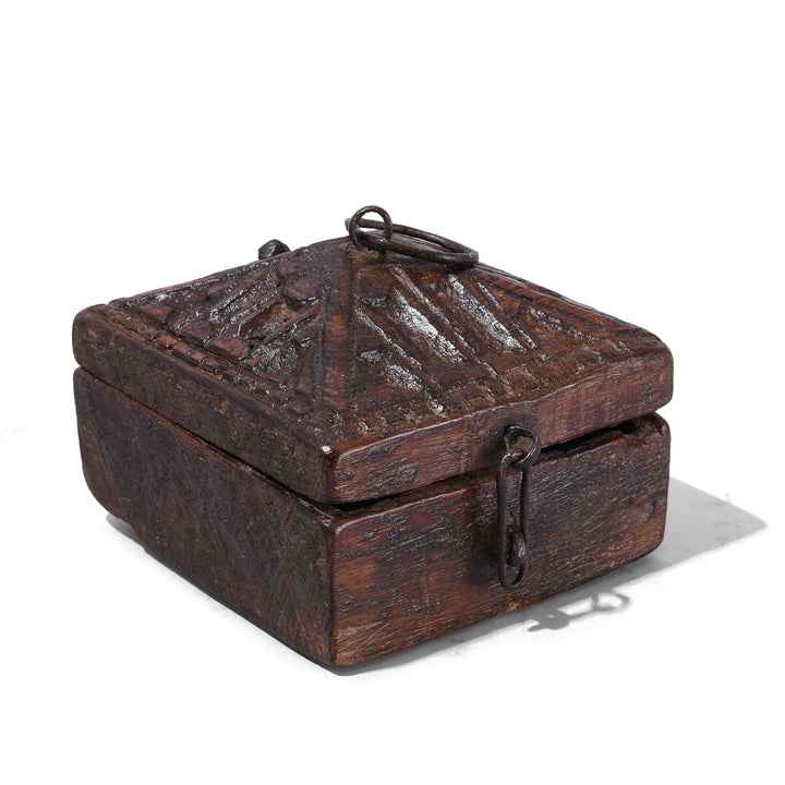 Angled VIew Of Carved Teak Tika Box From Banswara With Tribal Geometric Lid And Red Pigment Interior