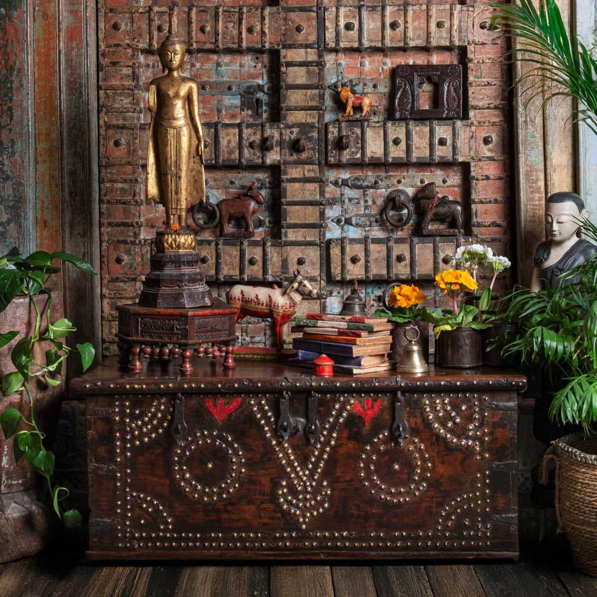 Antique cosy bazaar filled with Indian antiques and Thai Buddhas on an old Zanzibar chest | Indigo Antiques