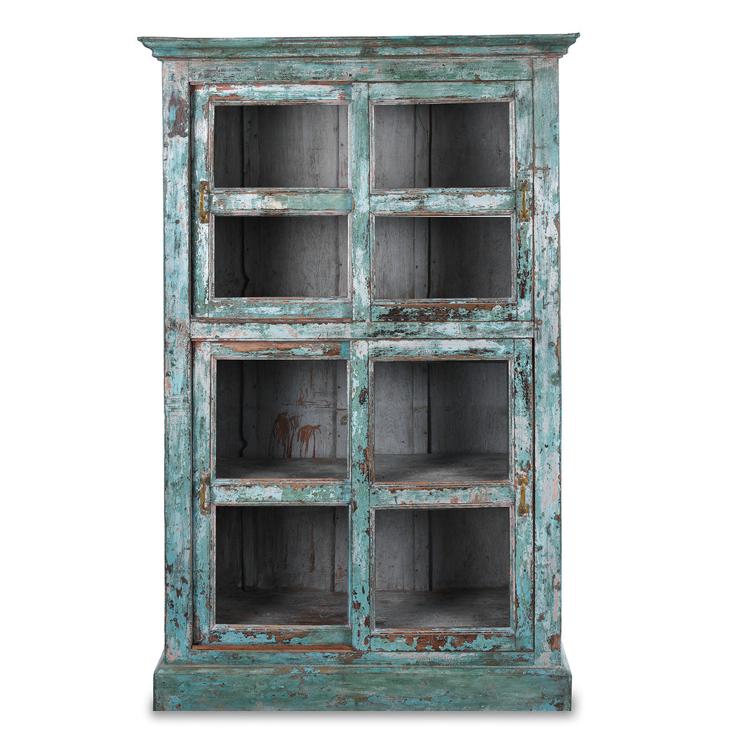 Green painted Indian teak glazed cabinet circa 1920 with four sliding glass panels, three fixed shelves and distressed original paint | Indigo Antiques