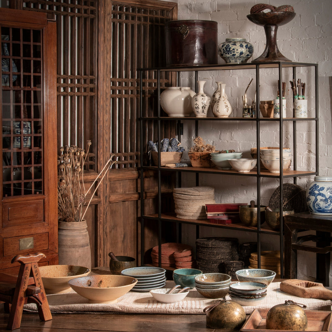 Industrial shelving in a rustic wabi sabi interior