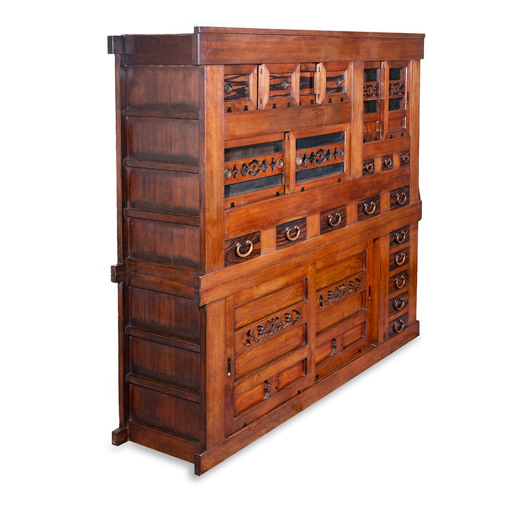 Angled VIew Of Japanese Meiji Period Mizuya Dansu Kitchen Chest With Sliding Doors And Multiple Drawers In Mixed Native Woods