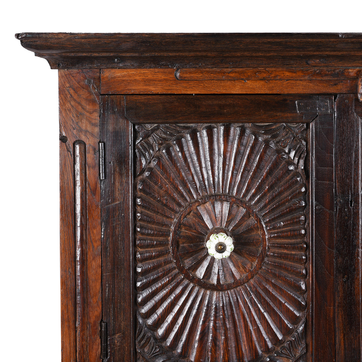 Corner Detail From Indian Teak Almirah Cabinet With Hand-Carved Sunburst Panels, Two Drawers And White Ceramic Handles