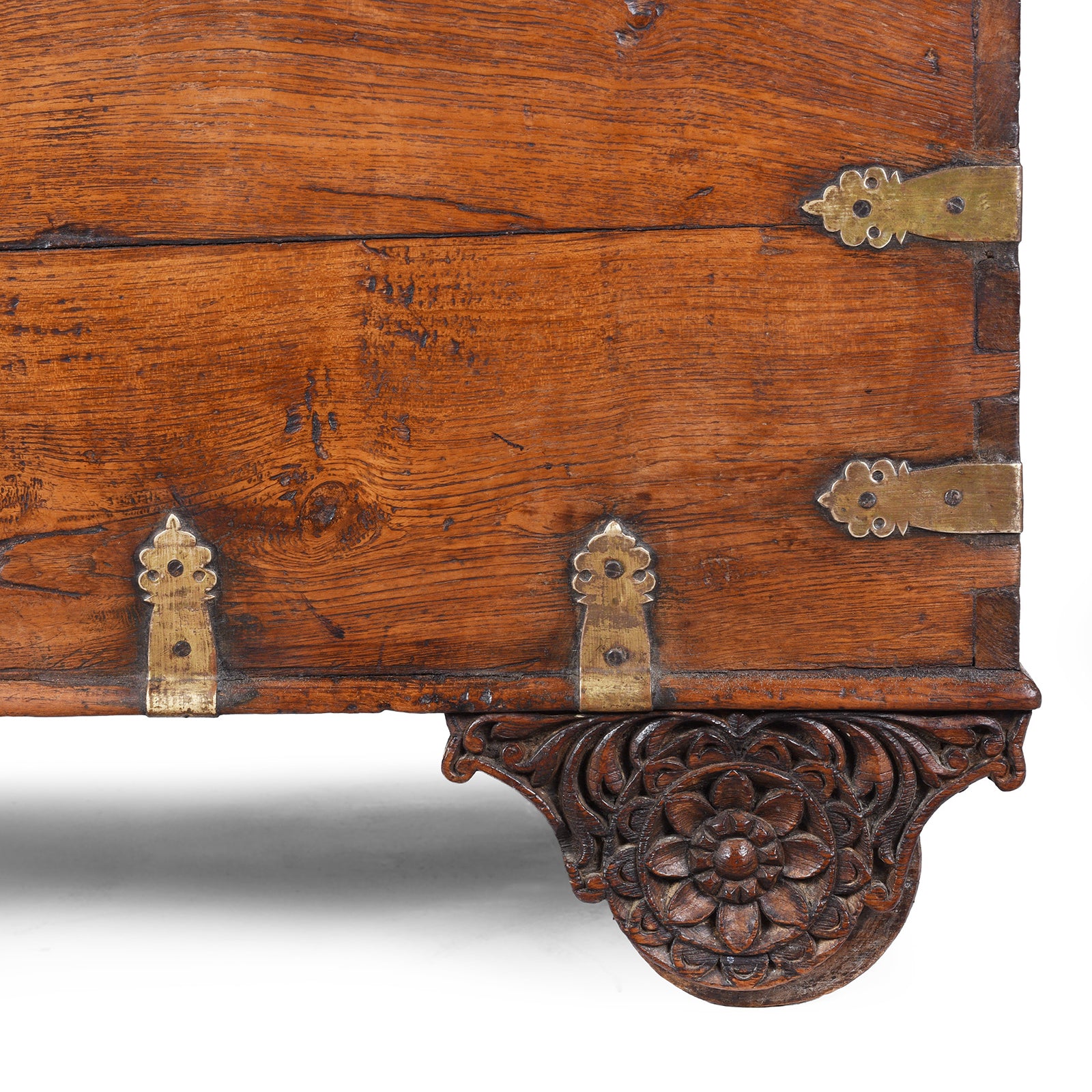 Carved Wheel Cover From Antique mid-19th century teak chest from Gujarat with hidden wheels, carved floral feet, and original iron fittings.
