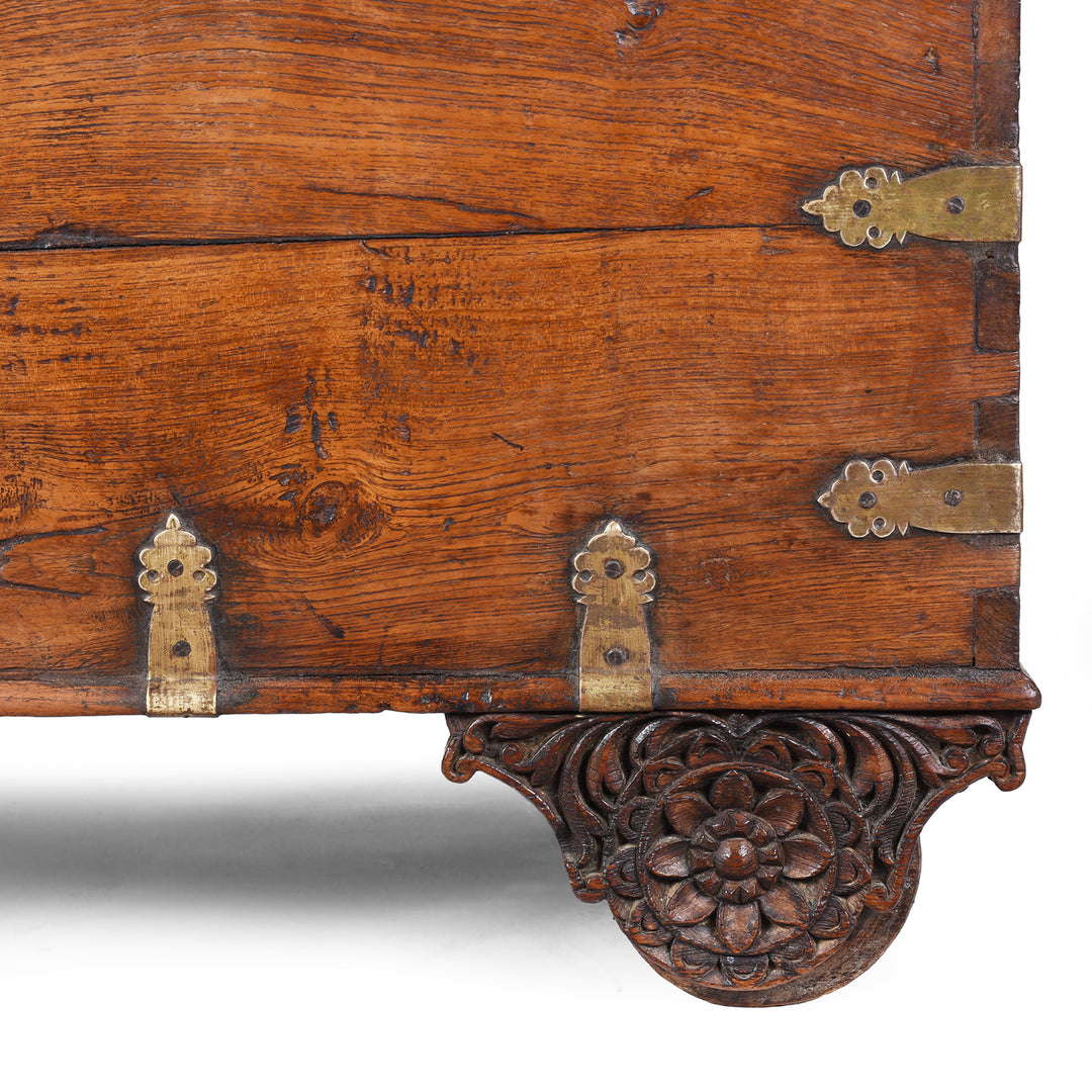 Carved Wheel Cover From Antique mid-19th century teak chest from Gujarat with hidden wheels, carved floral feet, and original iron fittings.