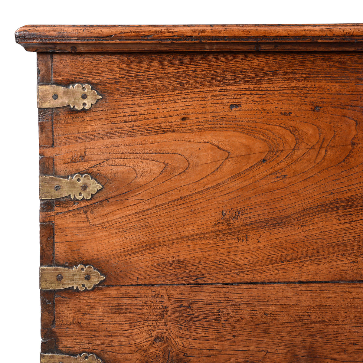 Corner Detail Showing Binding And Grain On Antique mid-19th century teak chest from Gujarat with hidden wheels, carved floral feet, and original iron fittings.