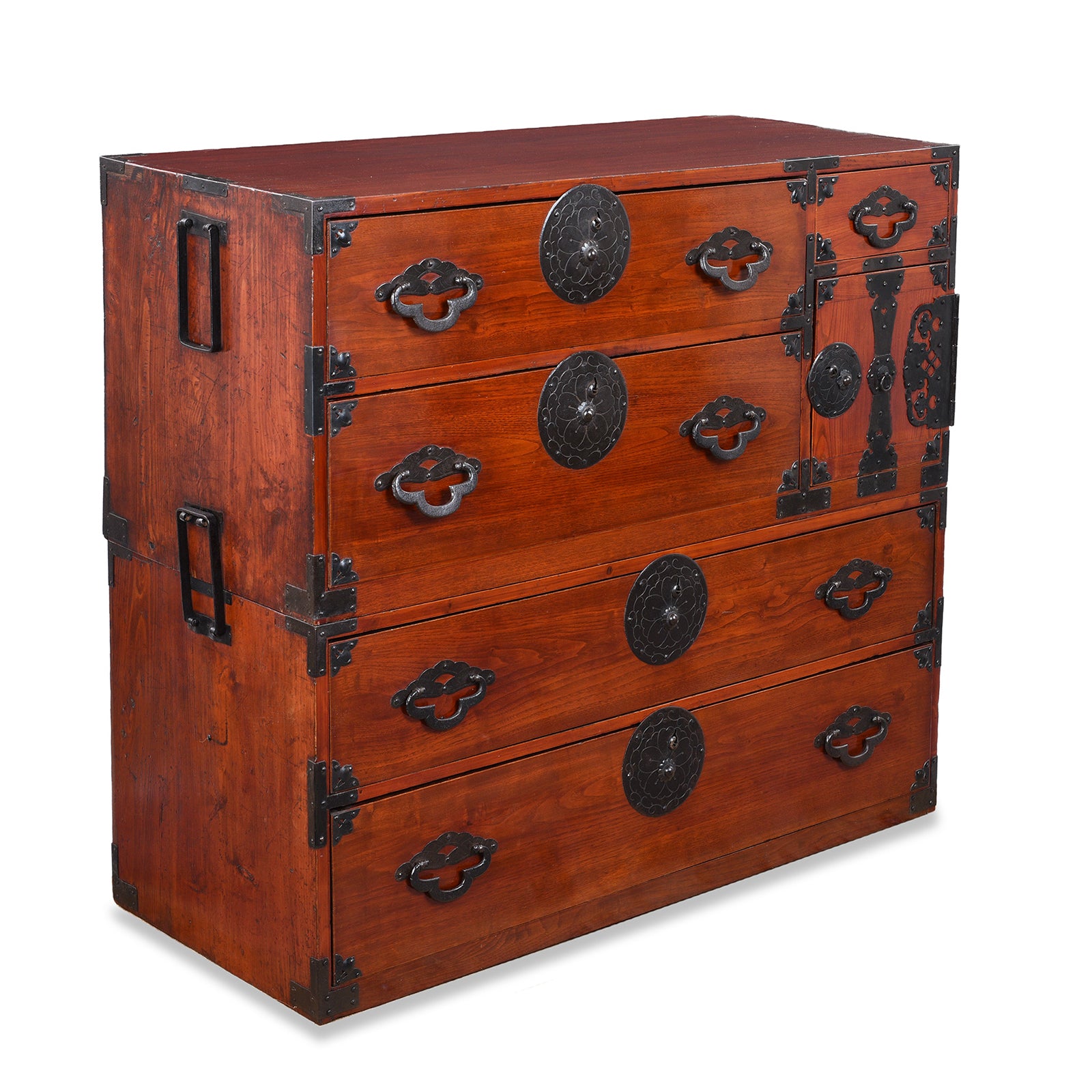Angled View Of Antique Japanese Tansu Chest With Lacquered Wood Finish And Ornate Iron Hardware