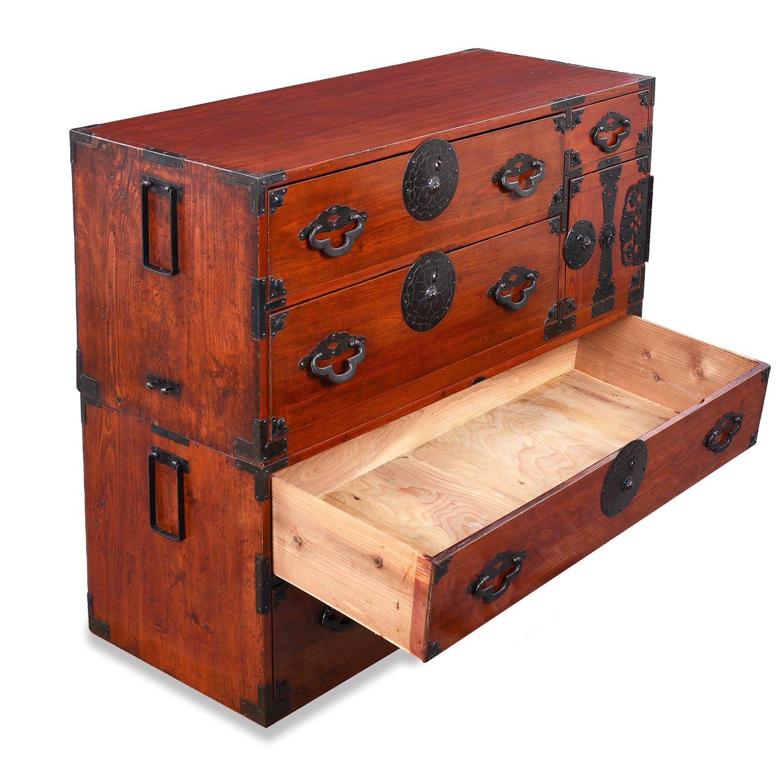 Open Drawer View Of Antique Japanese Tansu Chest With Lacquered Wood Finish And Ornate Iron Hardware