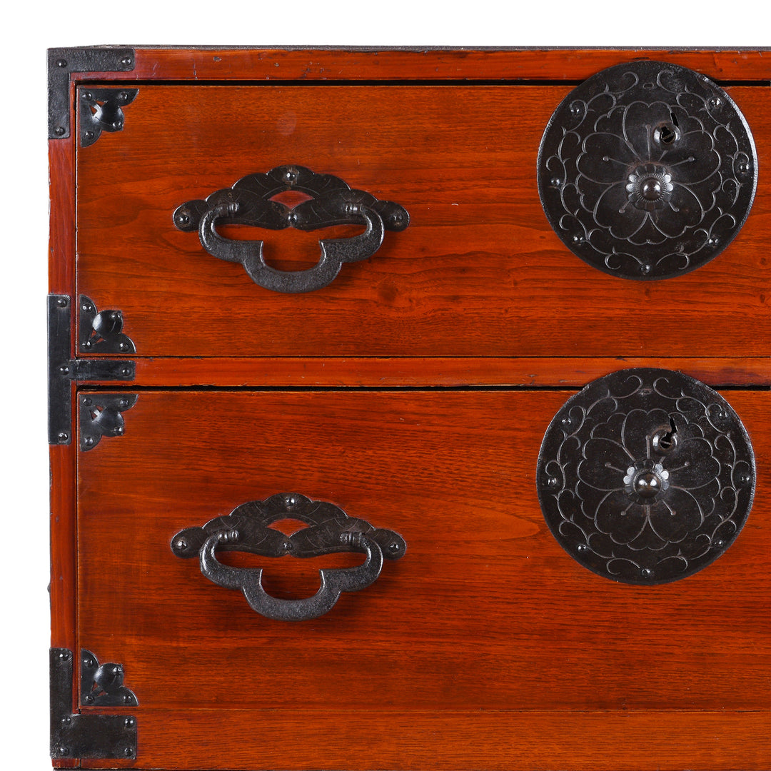 Corner Detail Of Antique Japanese Tansu Chest With Lacquered Wood Finish And Ornate Iron Hardware