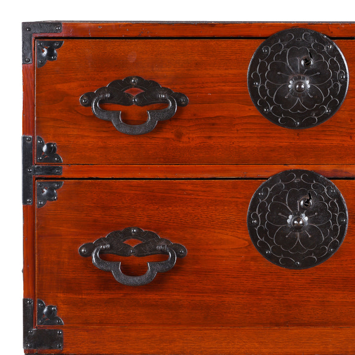 Corner Detail Of Antique Japanese Tansu Chest With Lacquered Wood Finish And Ornate Iron Hardware