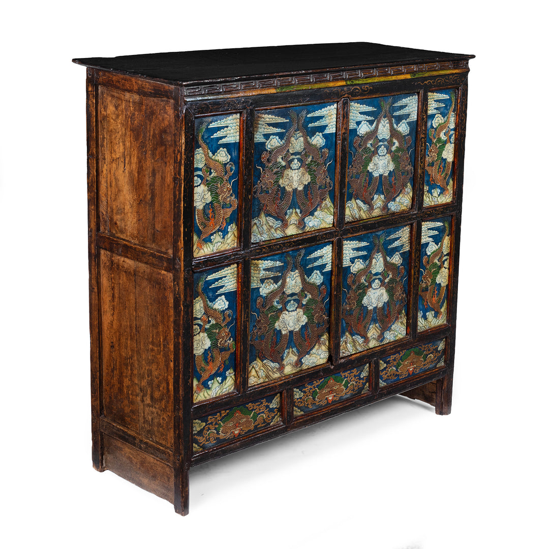 Angled VIew Of Tibetan Painted Altar Cabinet With Dragons And Clouds On Each Panel