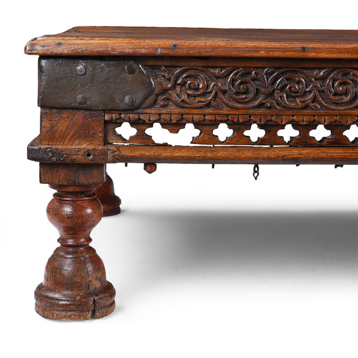 Carving And Leg Detail From Antique Nineteenth Century Gujarati Roheda Wood Takhat Coffee Table With Carved Apron And Turned Lacquered Legs