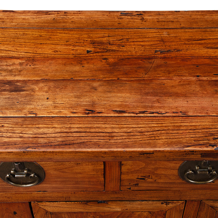 Surface Detail From Peking Ming Style Sideboard With Brass Fittings And Altar Top In Warm Patinated Wood