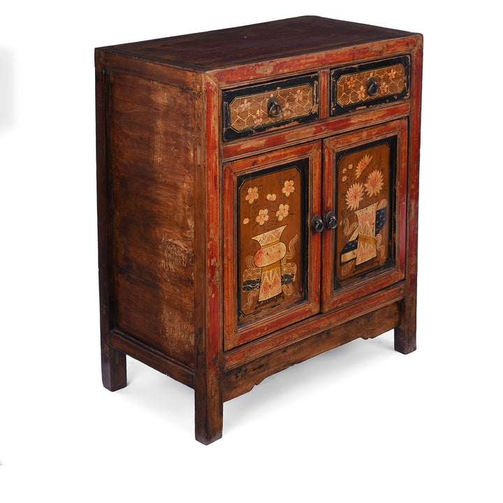 Angled View Of Painted Mongolian Side Cabinet With Floral Panels And Two Drawers