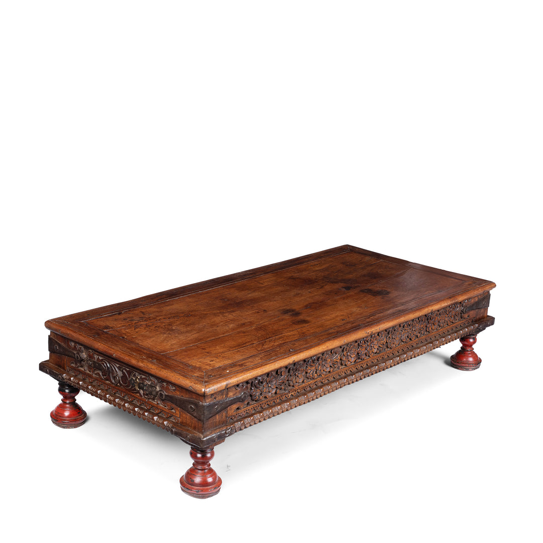 Angled View Of Bijou Antique Gujarati Takhat Coffee Table In Carved Teak | Indigo Antiques