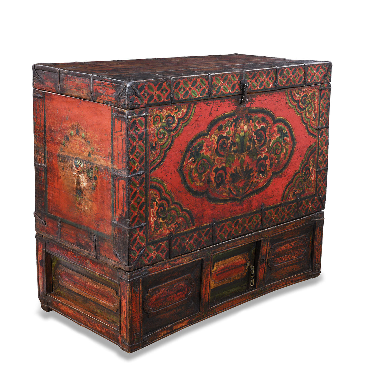 Angled VIew Of Decorative Eighteenth Century Central Tibetan Monastic Chest With Three Jewels Motif And Original Stand | Indigo Antiques