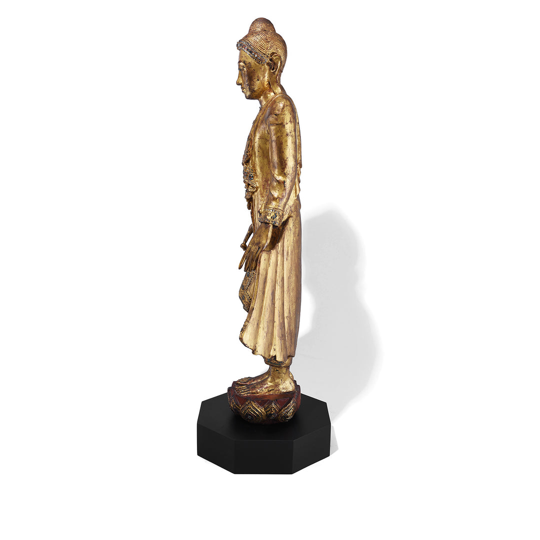 Side View Of Gilded Teak Standing Mandalay Buddha From Burma With Coloured Glass Inlay And Lotus Base | Indigo Antiques