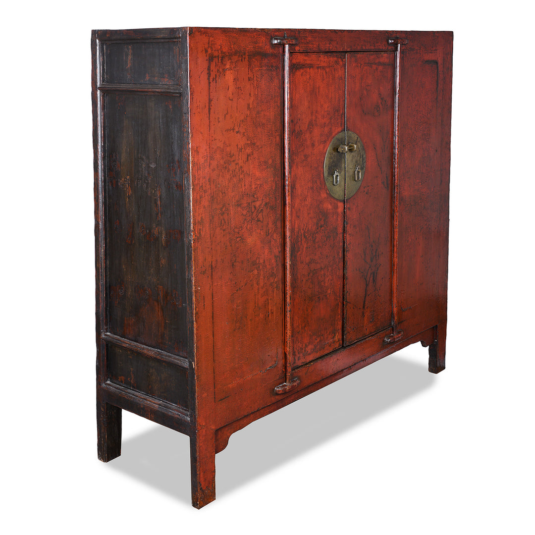 Angled VIew Of Antique 19th Century Qing Dynasty Shanxi Red Lacquer Wedding Cabinet In Original Peking Red With Brass Lock Plate | Indigo Antiques