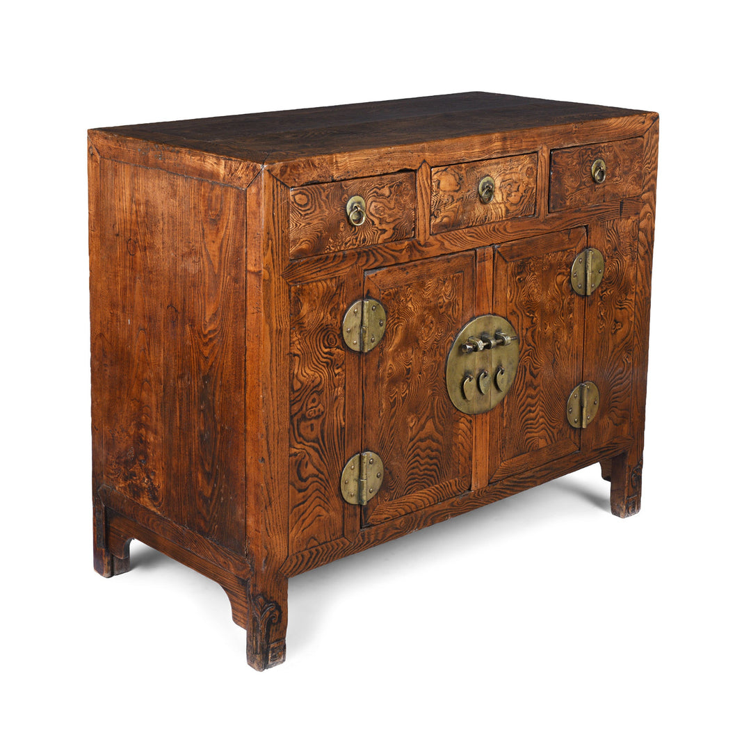 Angled View of 19Th Century Tianjin Burr Elm Sideboard With Brass Hardware And Three Drawers | Indigo Antiques