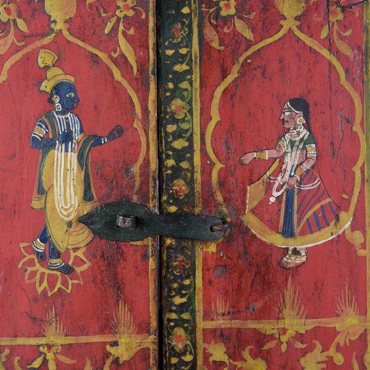 Shutters Artwork Detail From 19th-century painted teak window shutter from Rajasthan depicting Radha and blue-skinned Krishna beneath cusped arches with floral borders and original iron latch | Indigo Antiques