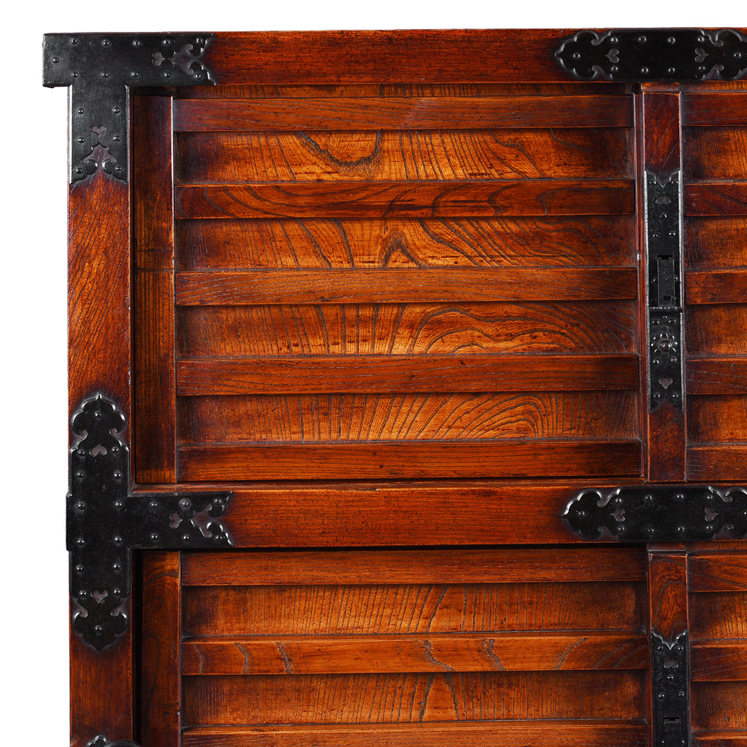 Corner And Wood Grain Detail From Japanese Edo Period Yonezawa Kuruma Dansu In Keyaki Wood With Urushi Lacquer Original Ironwork Sliding Doors Hidden Drawers And Wheels | Indigo Antiques