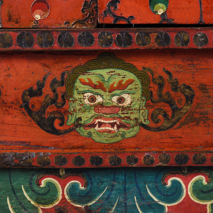 Face Detail From 19th Century Painted Tibetan Torgam Cabinet With Hand Painted Snow Lions Protective Buddhist Motifs And Original Interior Shelf | Indigo Antiques
