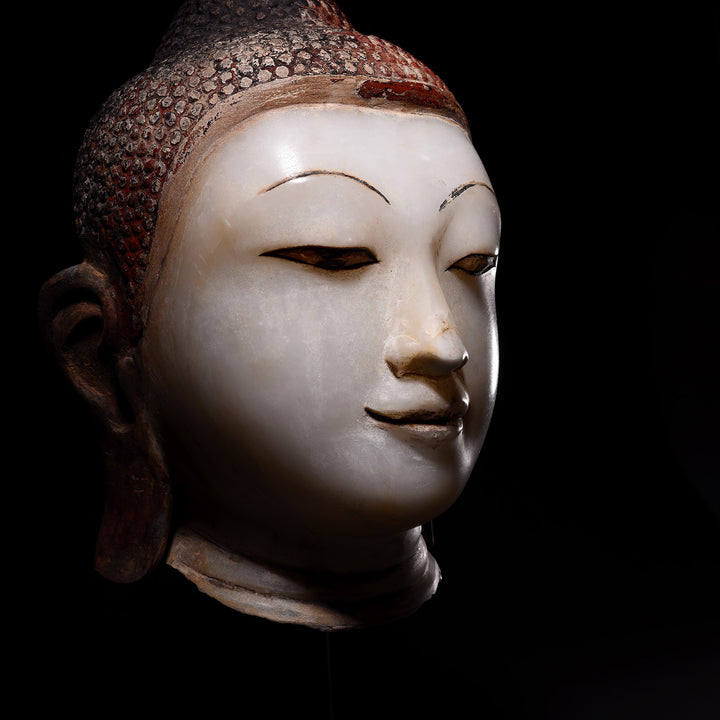 Angled VIew Of Antique Alabaster Buddha Head On Stand | Indigo Antiques
