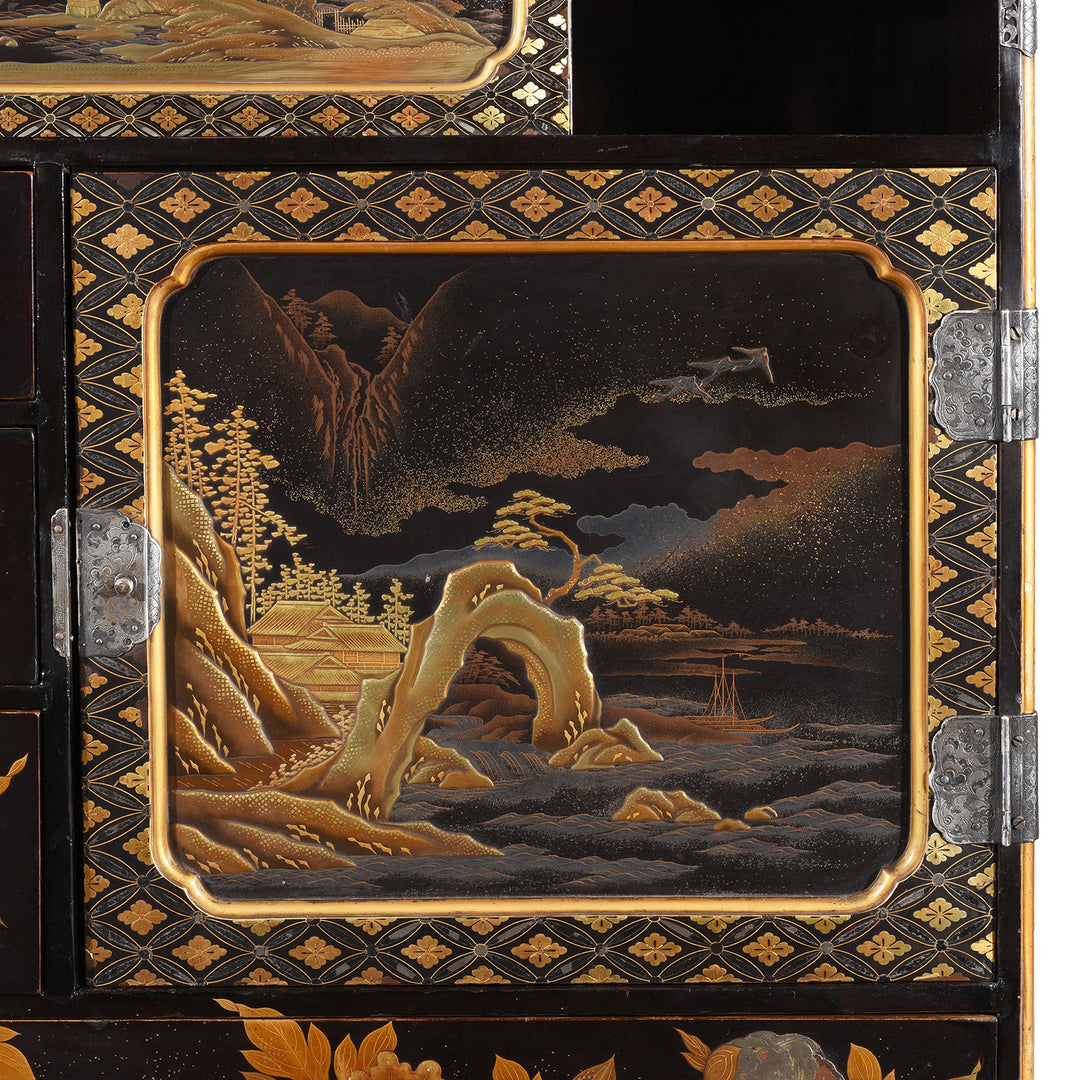 Inlaid silver cranes over  takamaki-e high relief on a Japanese Gilt Black Lacquer Meiji Kodansu with silver filigree work | Indigo Antiques