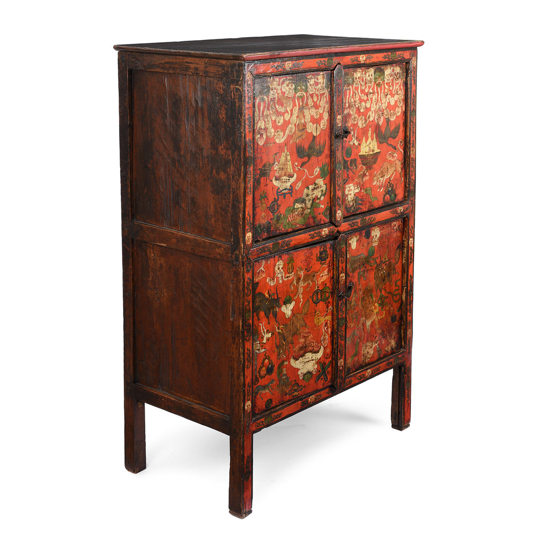 Side detail of an Antique Painted Tibetan Mahakala Torgam Cabinet Decorated with Skulls and for holding Torma - 18thC