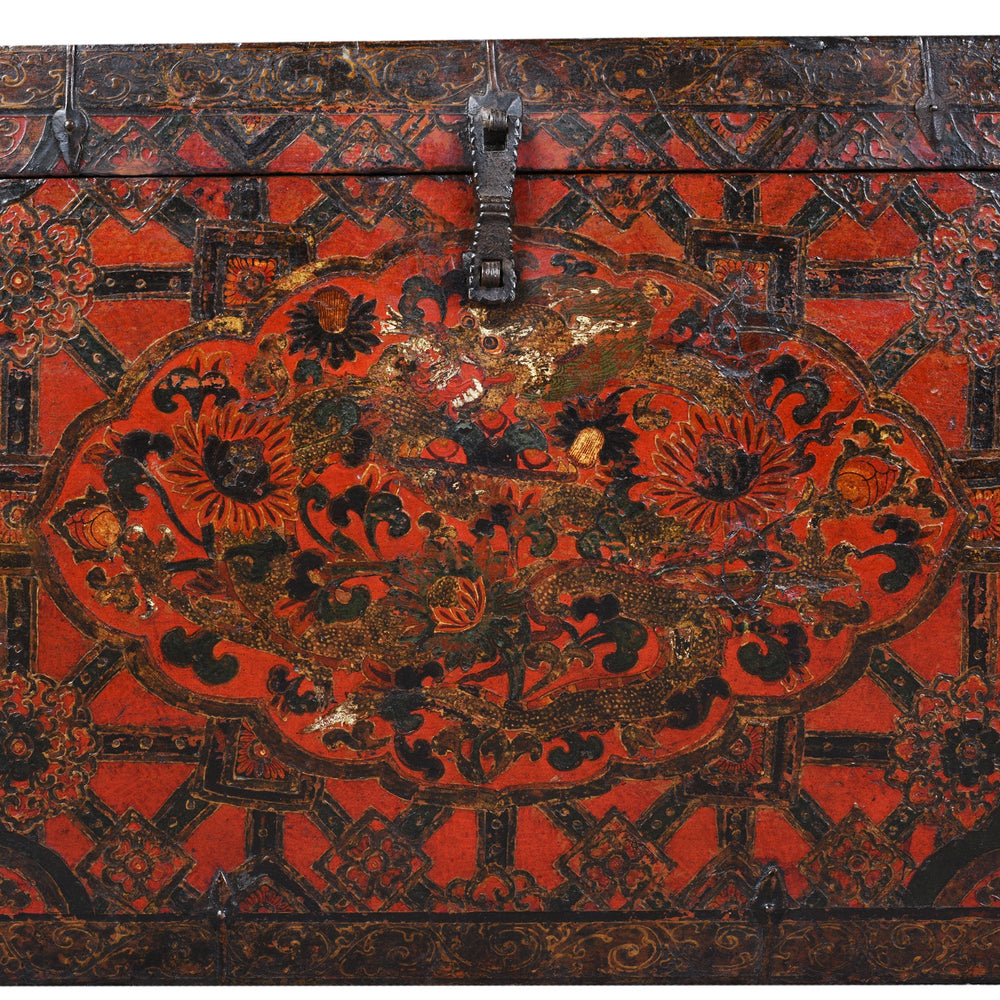 Paintwork Detail From Antique Tibetan Painted Storage Chest With Red And Gold Floral Motif And Central Dragon Design
